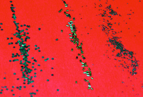 The photo shows (left to right) flake, extruded and ball powder.